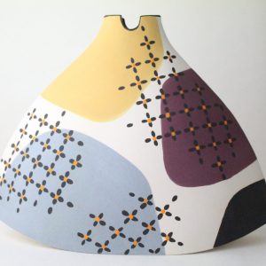 Ceramic fan-shaped vessel with abstract patchwork design by Jacqui Atkin