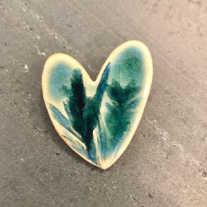 Large ceramic botanical heart brooch in a teal, glassy glaze