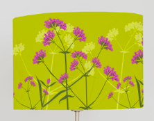 Lampshade, pink Verbena flower against bright green background