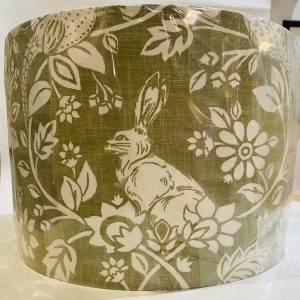 Lampshade, hare and floral design on a sage green background