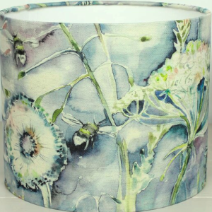 Lampshade, floral design in soft blue and green hues against blue background