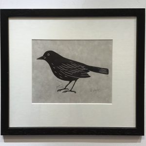 Framed lino cut print of a Blackbird