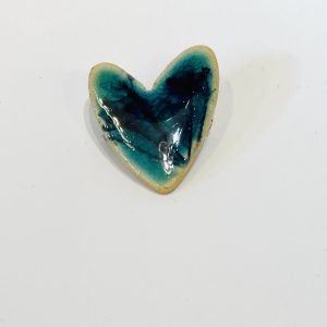 Small ceramic botanical heart brooch in a teal, glassy glaze