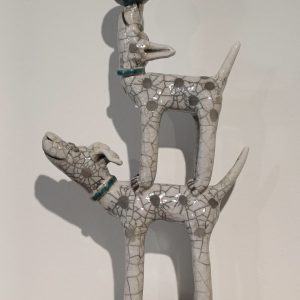 Handmade stoneware raku fired spotty dog, standing on the back of another spotty dog