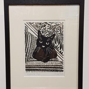 Framed lino cut print of a cat on the stairs